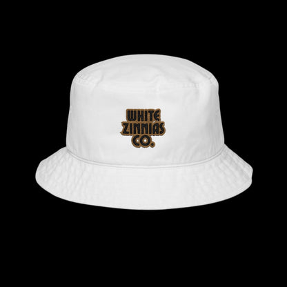 White bucket hat with 'White Zinnias Co.' logo on a white background