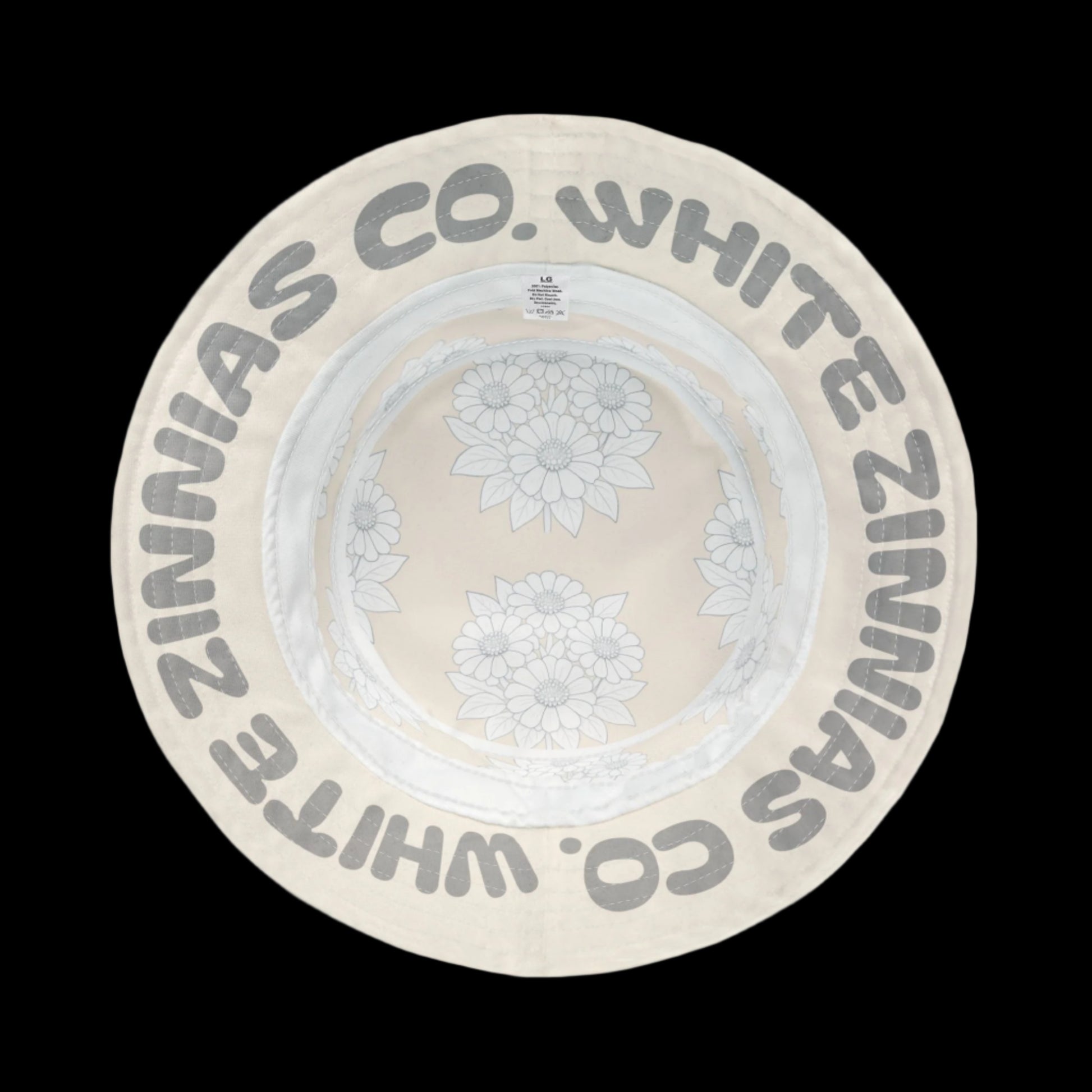 White Zinnias Co. sun hat with floral design on a white background